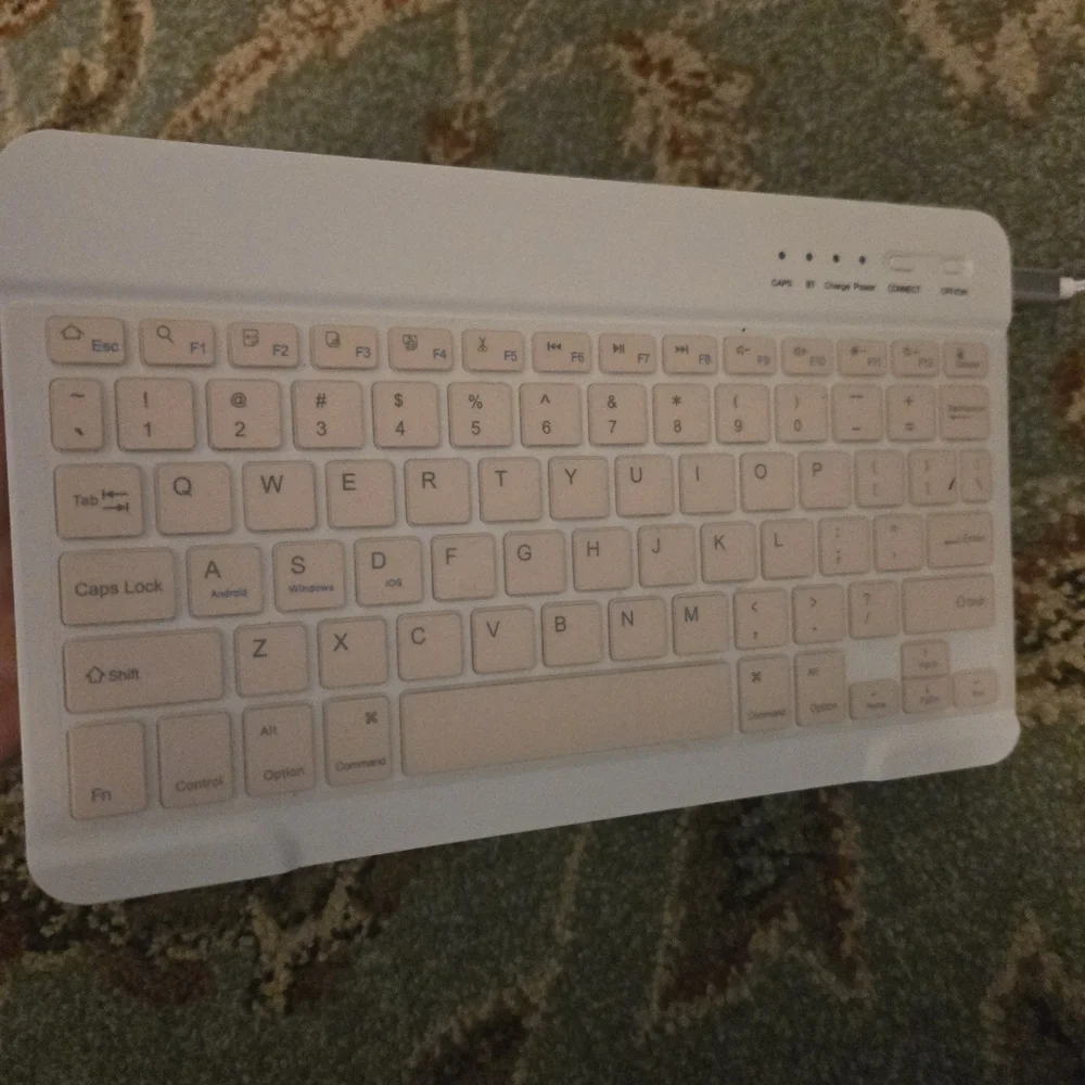 Bluetooth Keuboard For Cell Phones Or Tablets Comes With USB Cord Pink And White